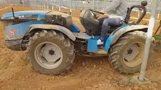 Tractores agrícolas trabajando en invernadero [upl. by Aicilaana]