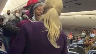 Woman kicked off plane after hitting flight attendant [upl. by Wohlen598]