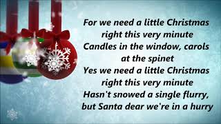 Johnny Mathis  We Need A Little Christmas Lyrics [upl. by Hubie]